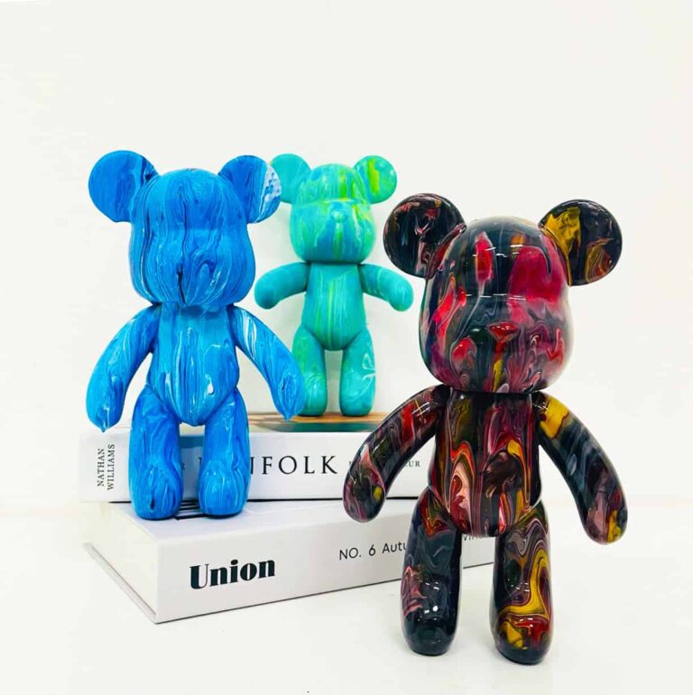 Multiple acrylic pour bear creations on display